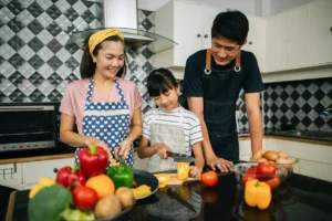 Happy asian family in the kitchen