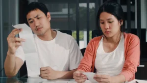 Asian couple worried about budget
