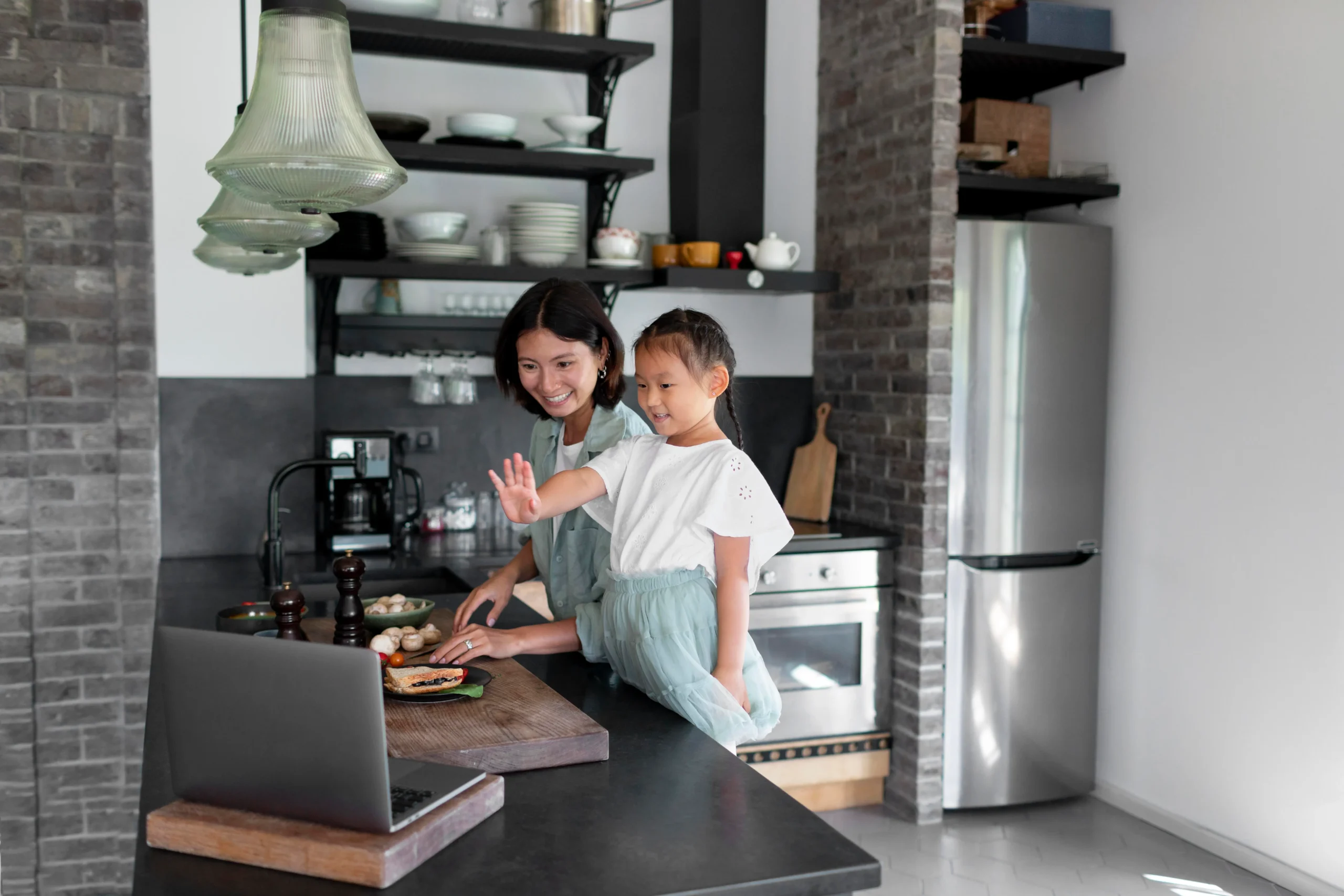 Asian mom and daughter in the kitchen bonding together